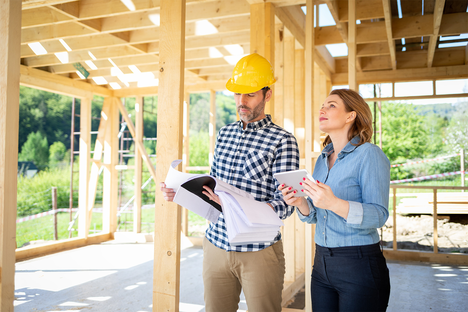 Architect and homeowner at home build site