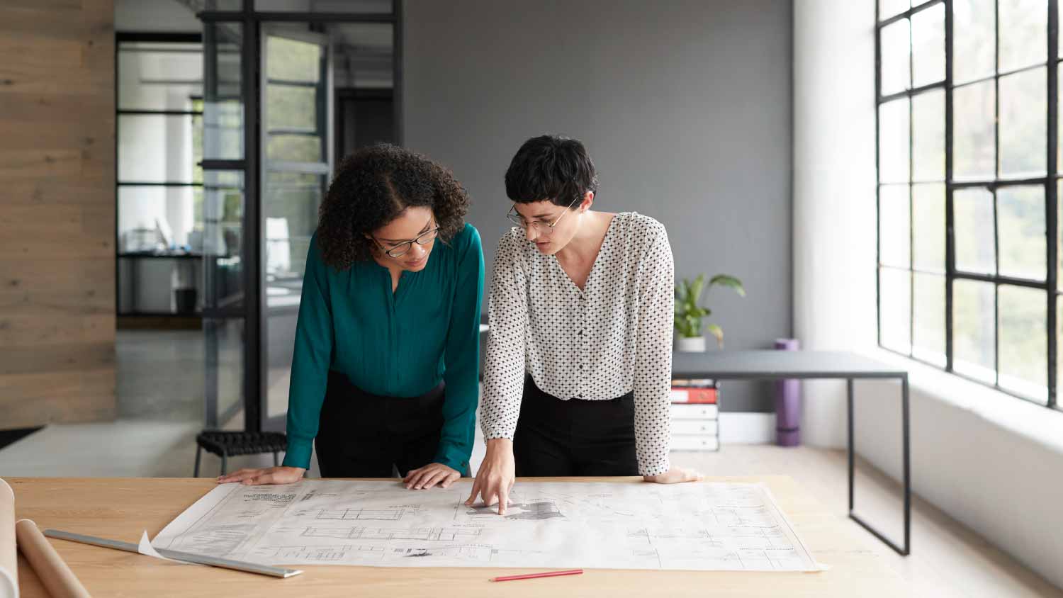 Architect checking blueprints