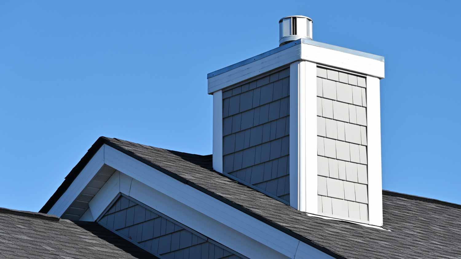 Chimney with siding on the roof