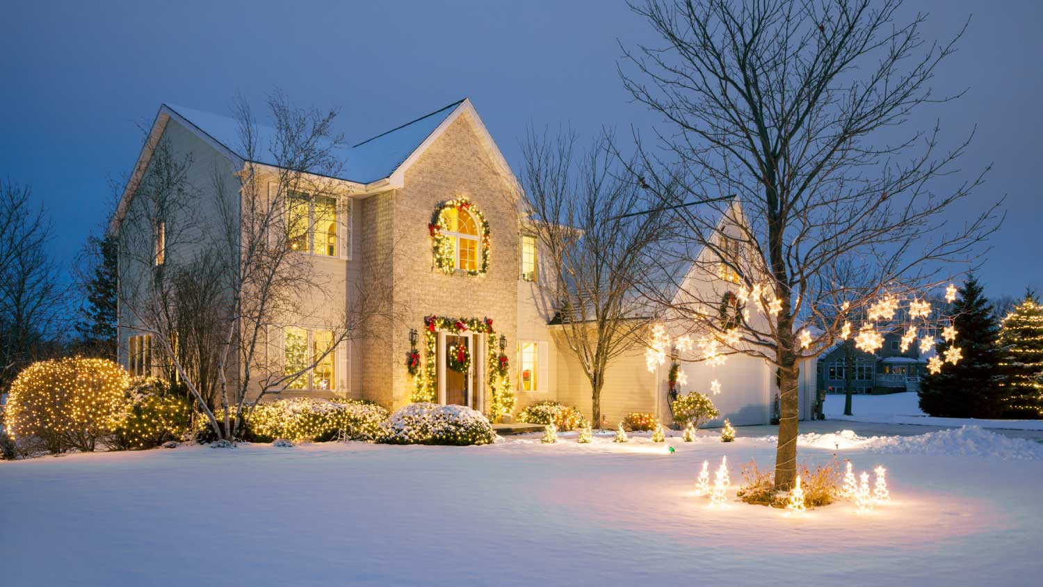 Christmas decorated home with holiday lighting