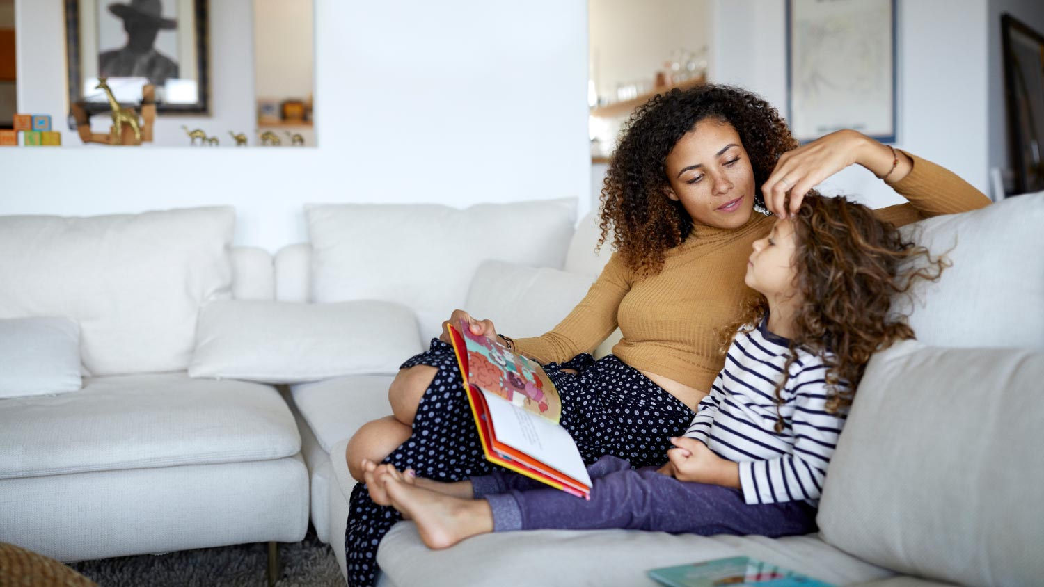 Mother and daughter reading a book