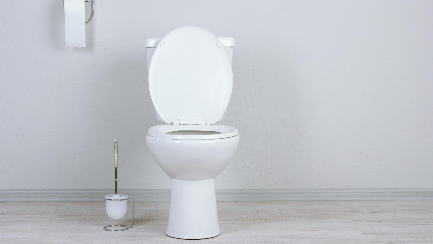 A white toilet bowl in a bathroom