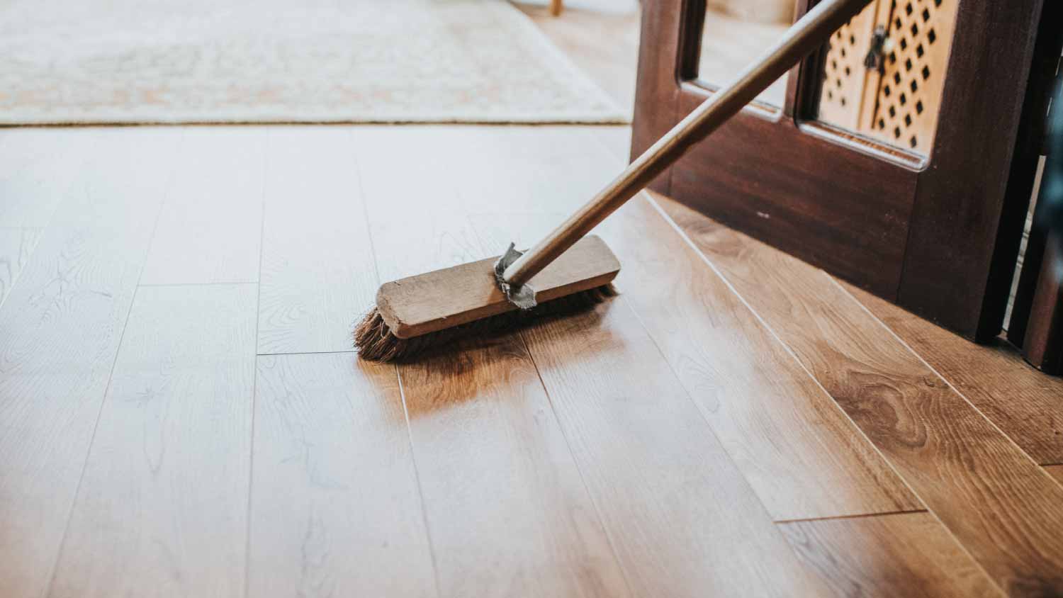 Woman brushing the floor