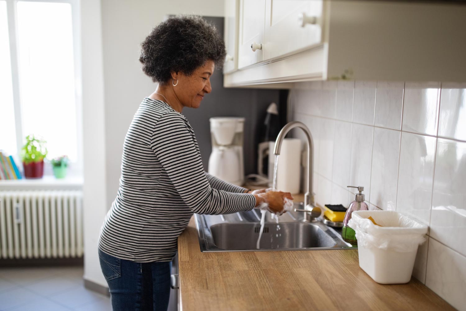 A woman washing her hands