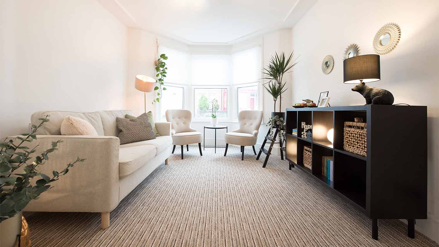 neutral themed living room with carpet 