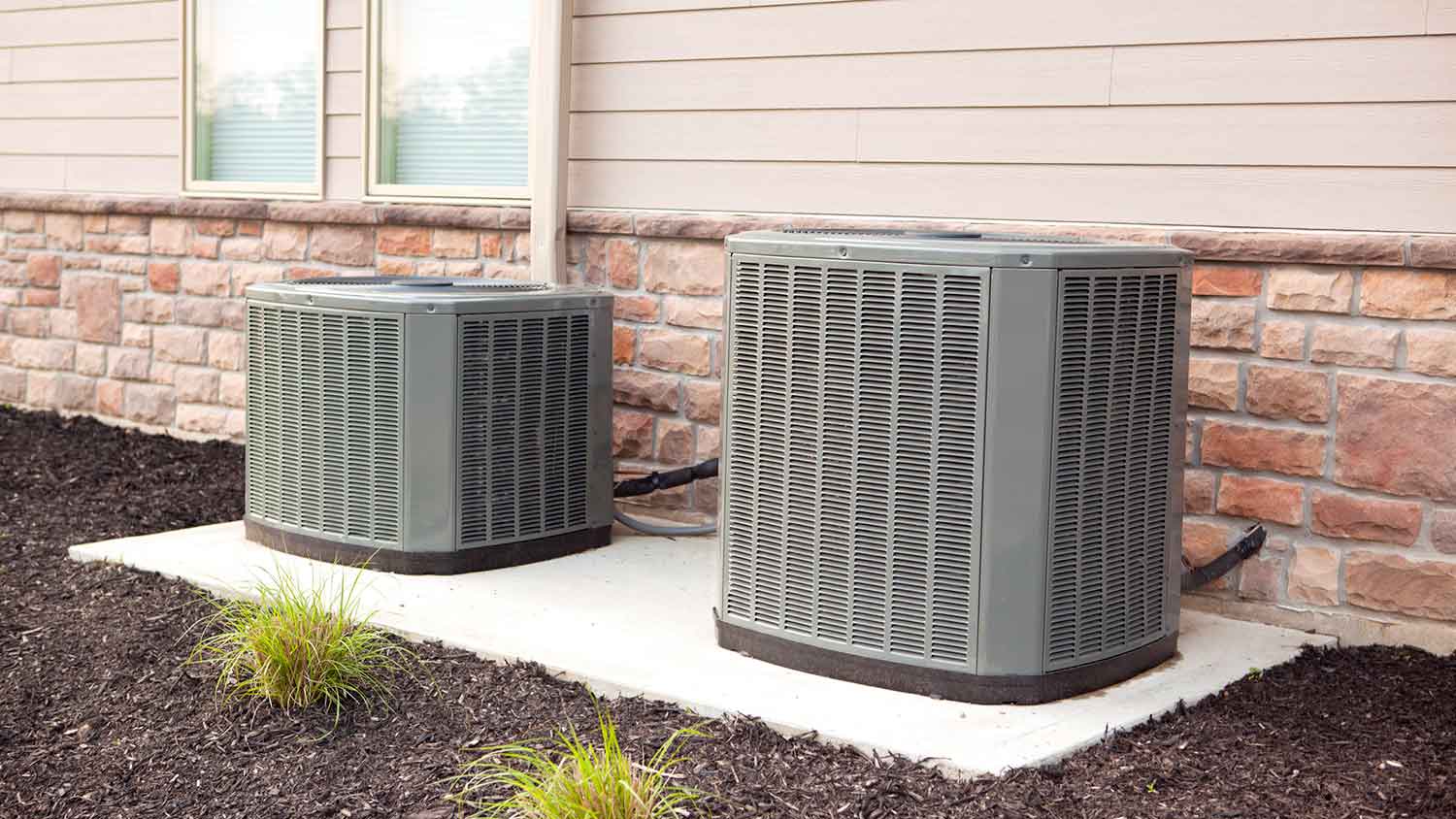 New air conditioner units on a concrete slab 