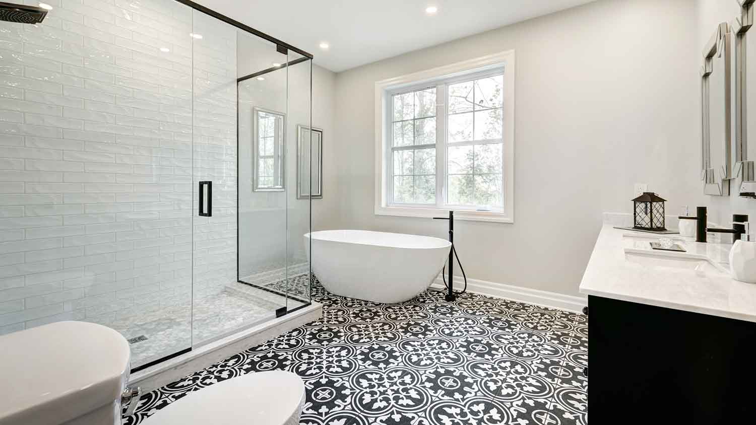 Bathroom with black and white patterned floor tile