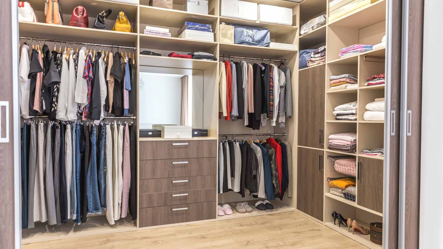 big wardrobe closet filled with clothes 