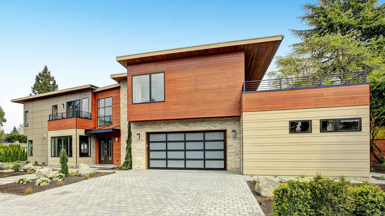 Stone and wood cladding installed on a contemporary style home