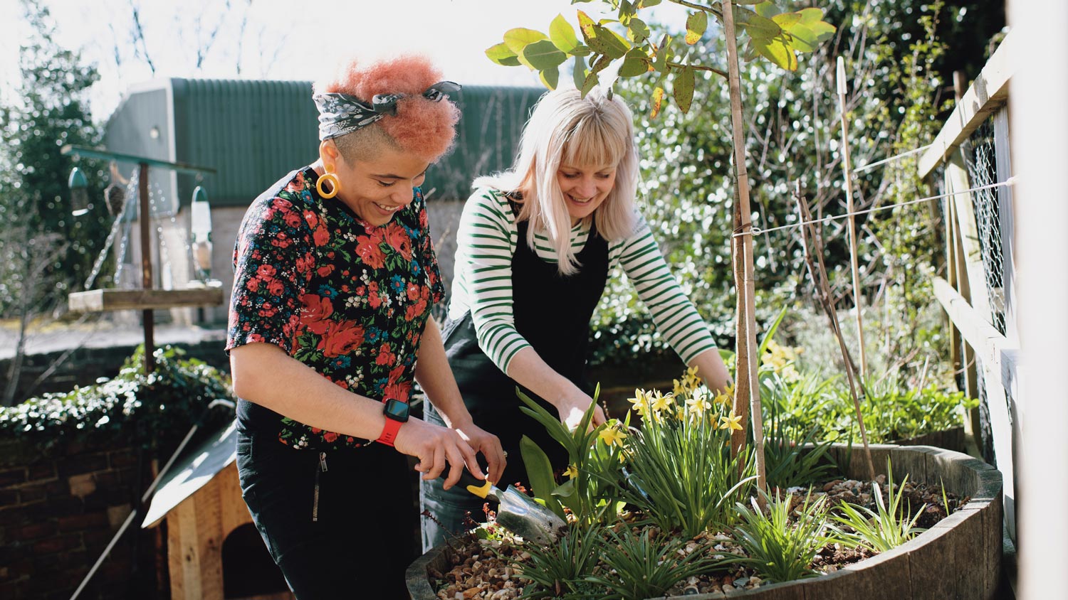 A couple at home gardening in spring