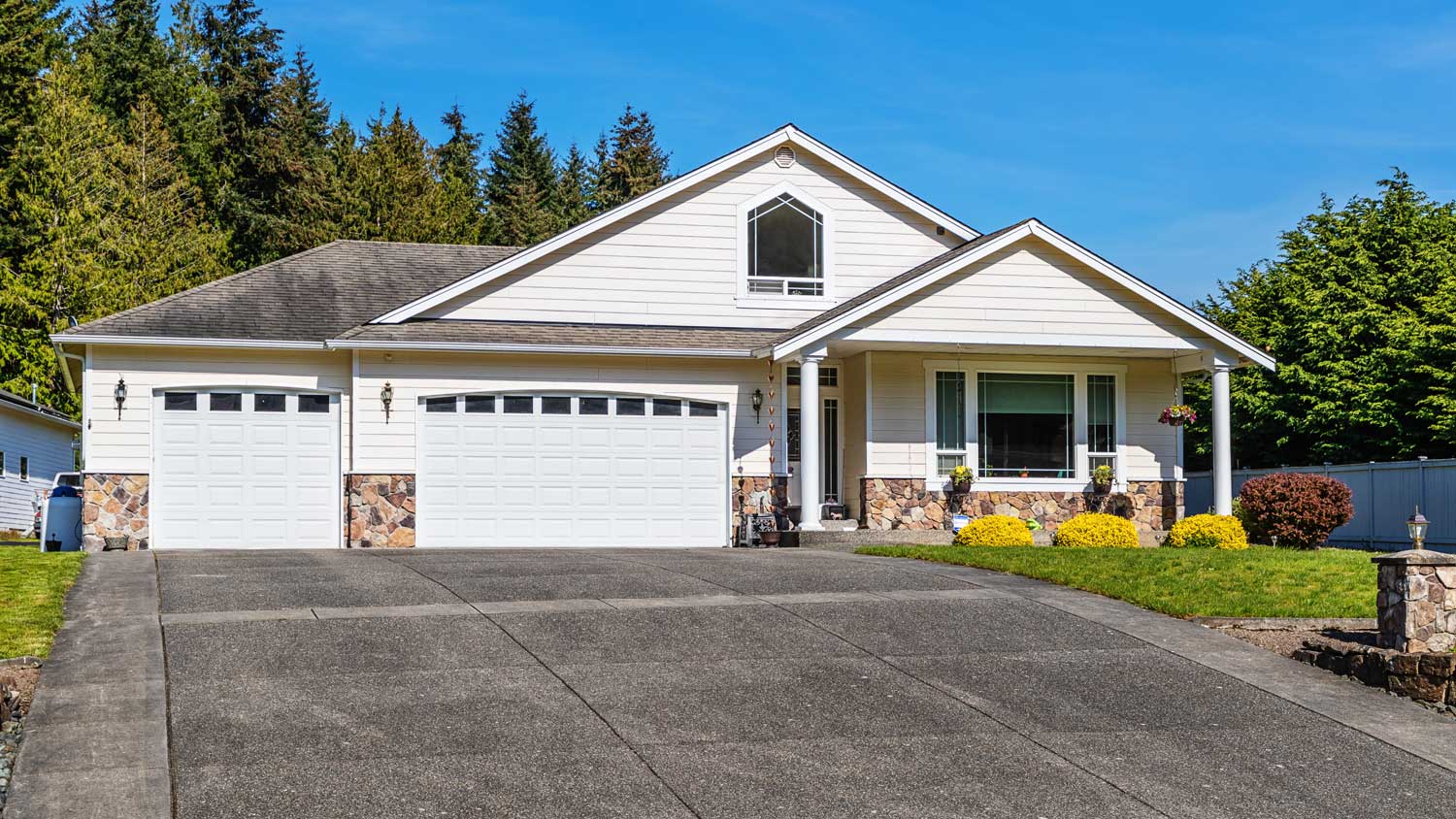 Single Story Suburban Home Exterior with Large Driveway