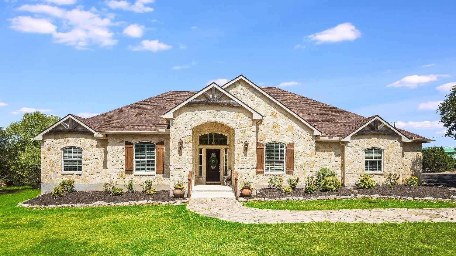 The exterior of a stone house 