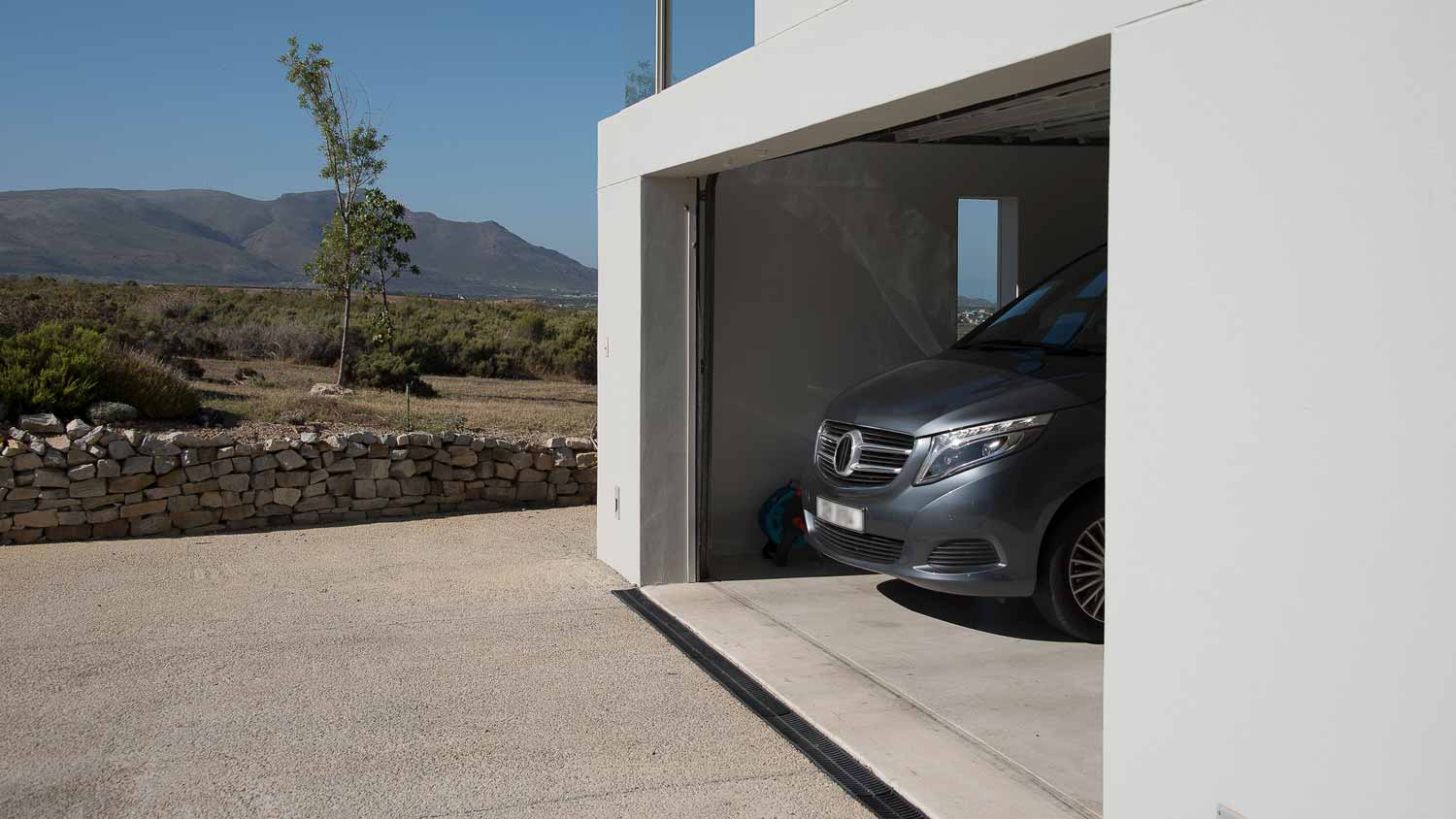 A residential garage with its door open