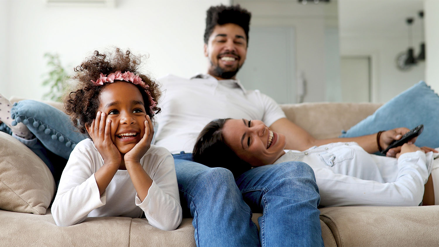 A happy family on a couch