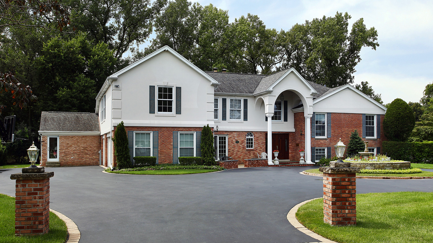 home with asphalt pave driveway         