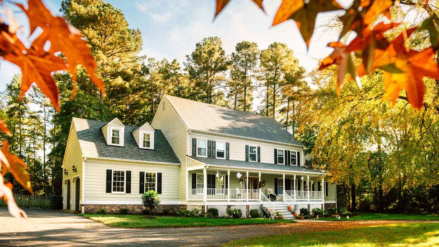 Colonial style house in the country with fall ornaments