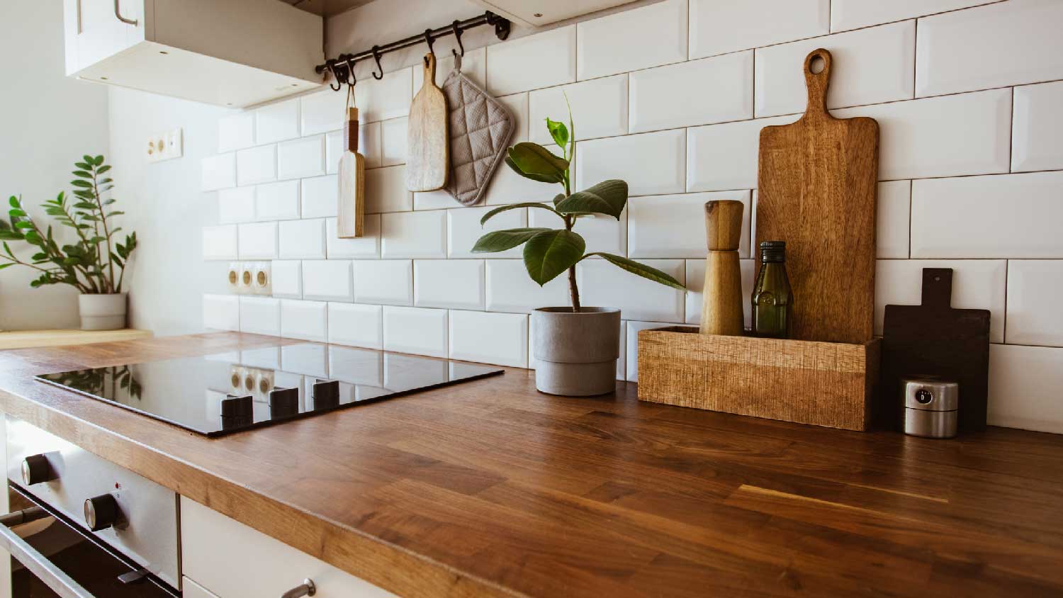 A kitchen with a butcher block countertop