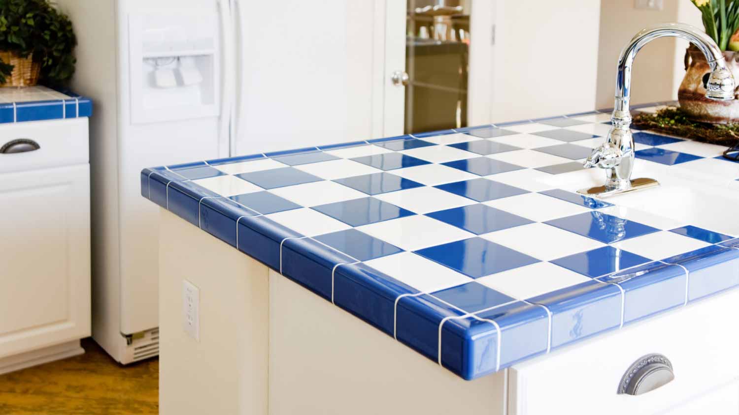 Kitchen interior with checkered white and blue tile 