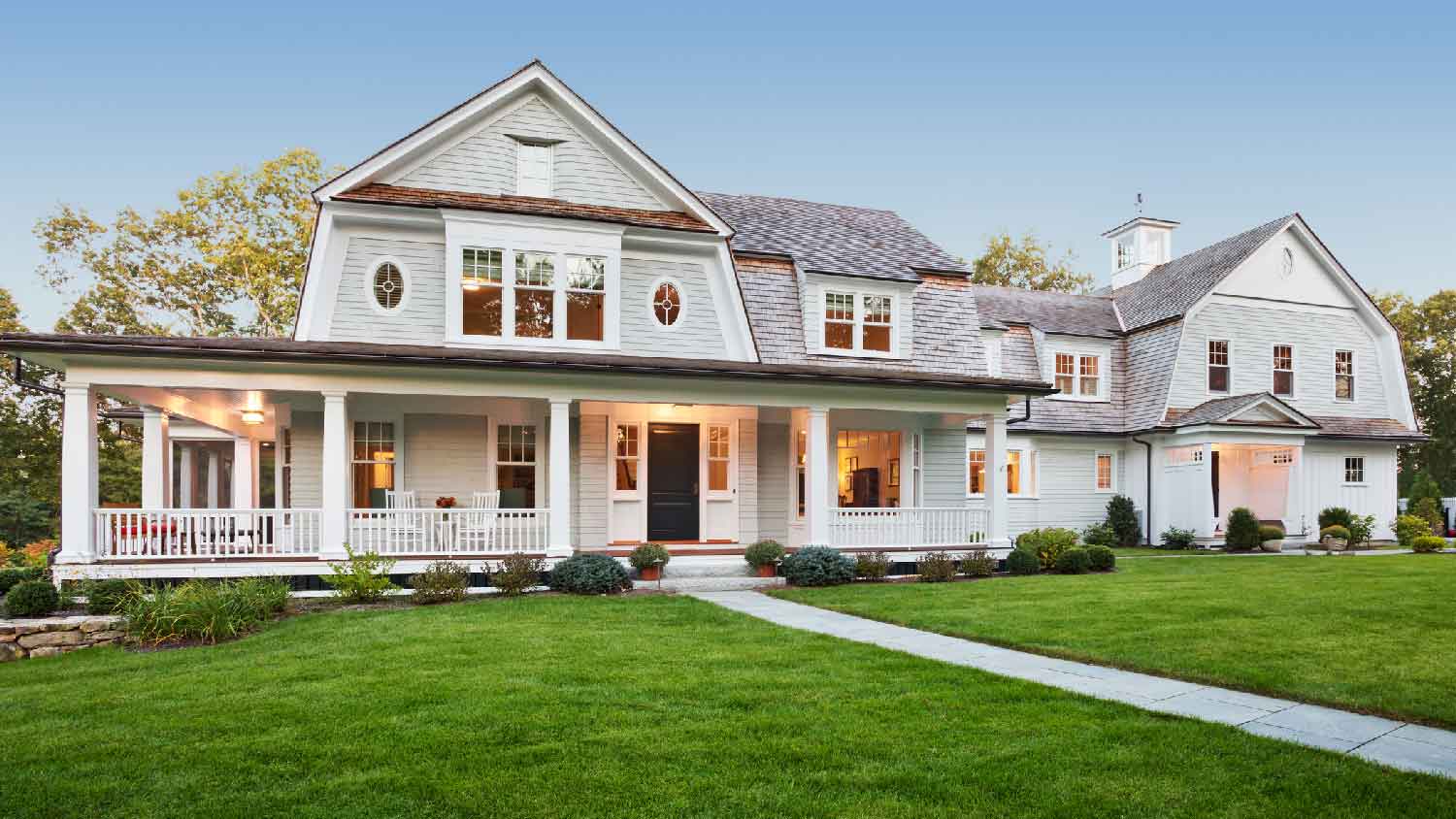 A large house with a wrap around porch