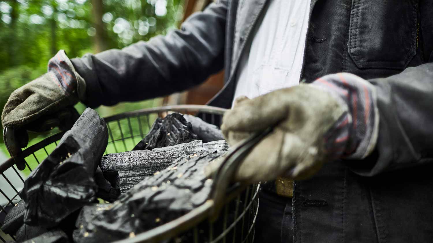 A man carrying charcoal in a basket