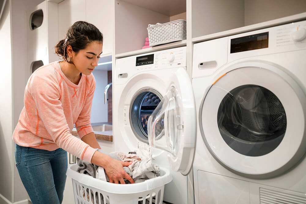 Person doing laundry at home