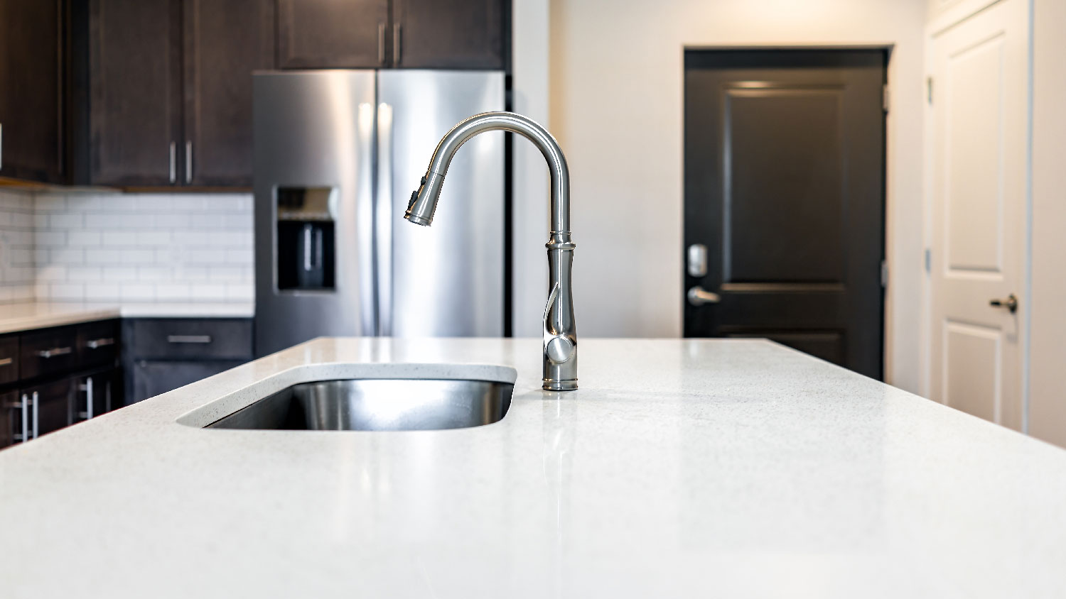 A quartz countertop with a cutout for a sink