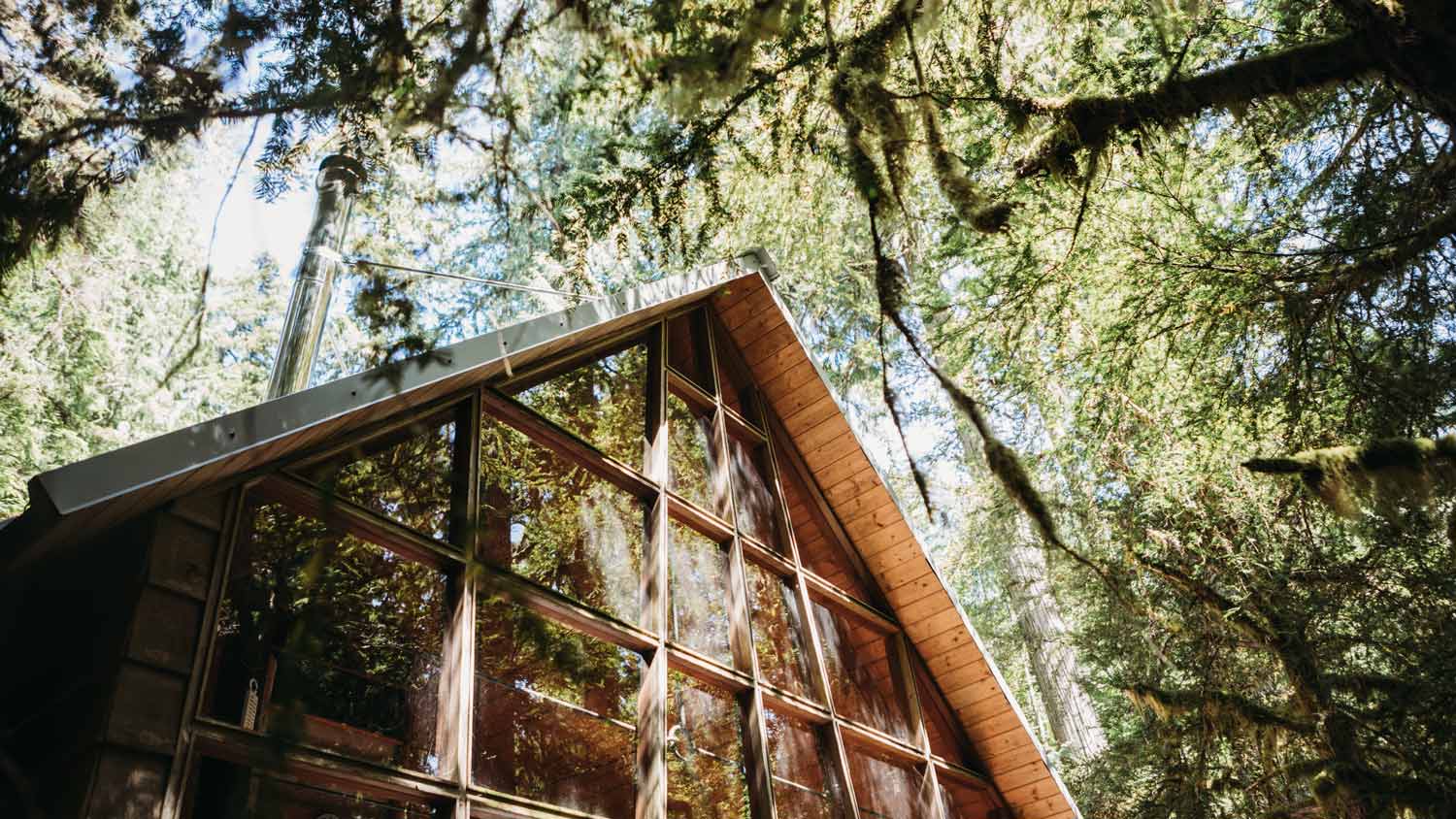A rustic cabin with an a-type roof