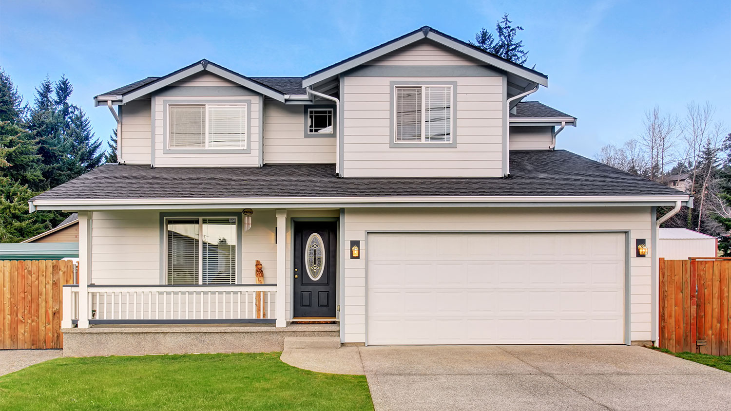 beige home with single driveway