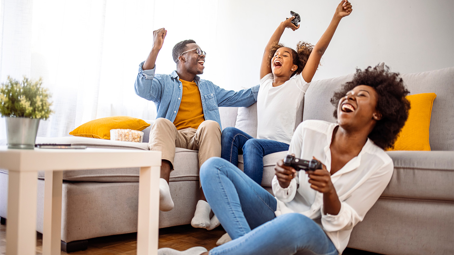 family playing video games in living room