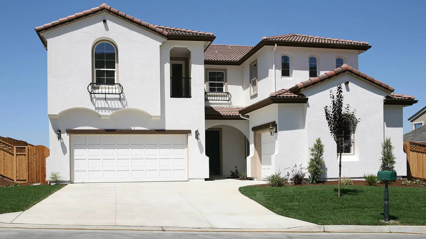 A beautiful white stucco siding house