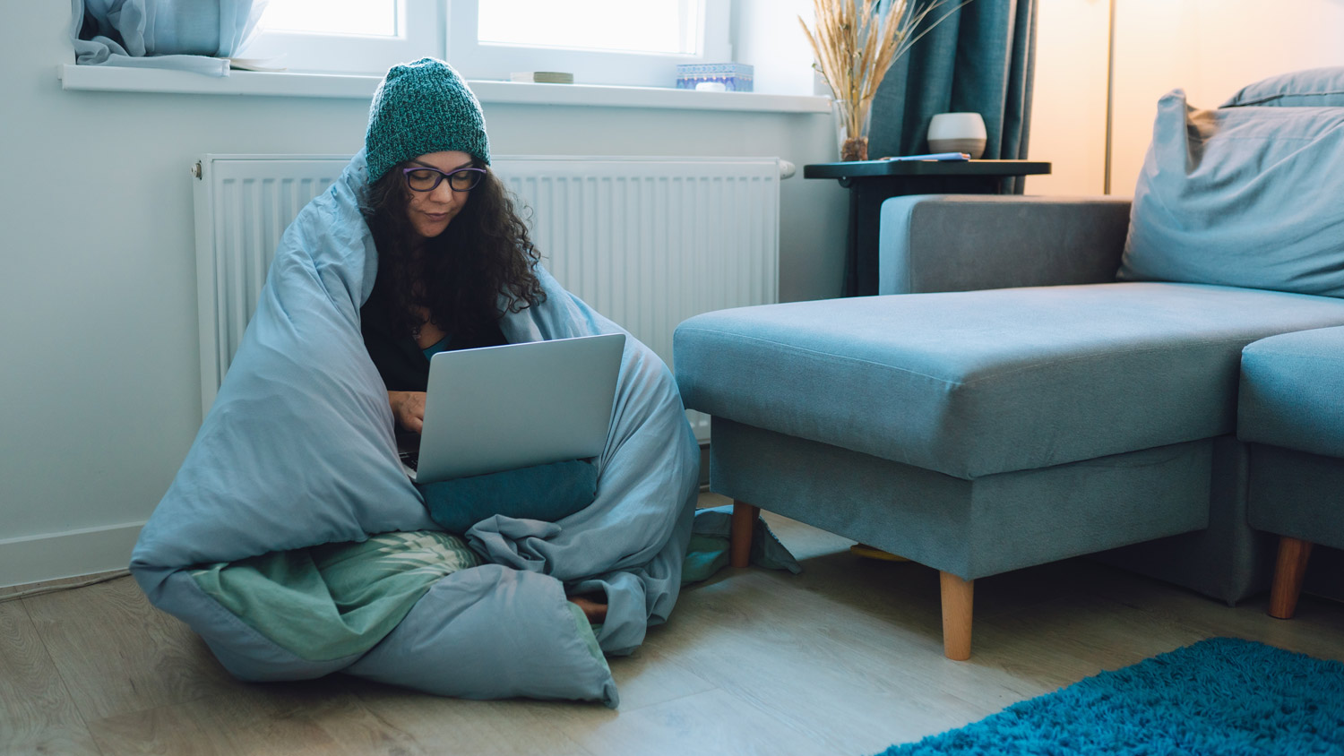 Woman feels cold while working at home