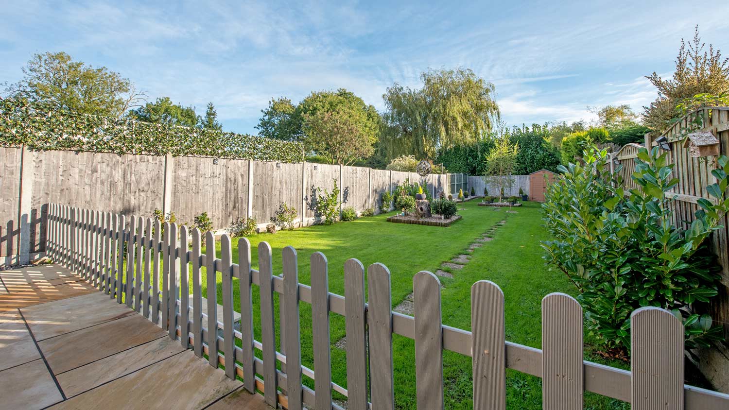 View of backyard with 2 fences